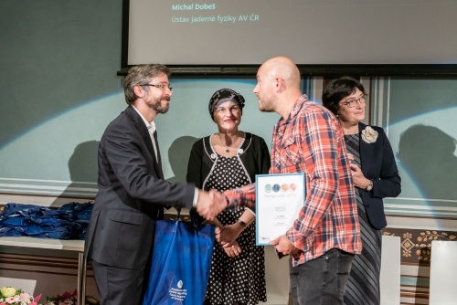 Michal Dobeš (on the right side) receives award for his photo Inflated frog