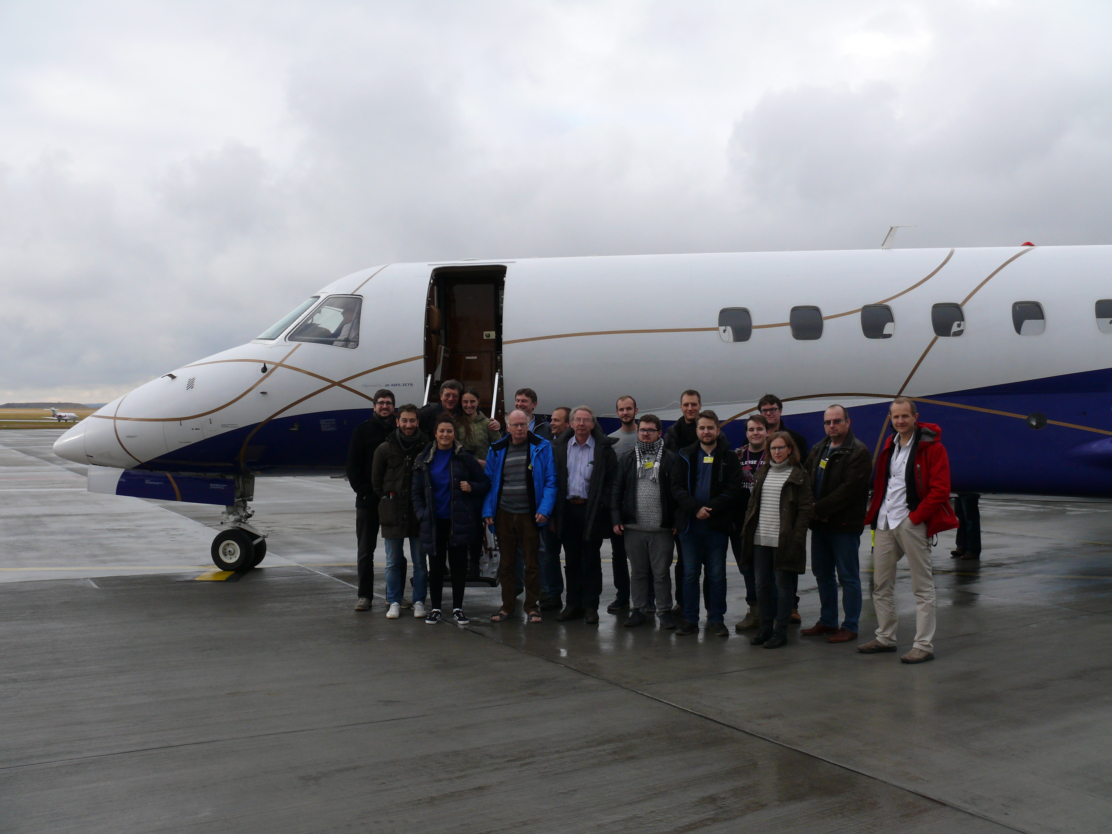 Czech and foreign experts in front of plane for experiment