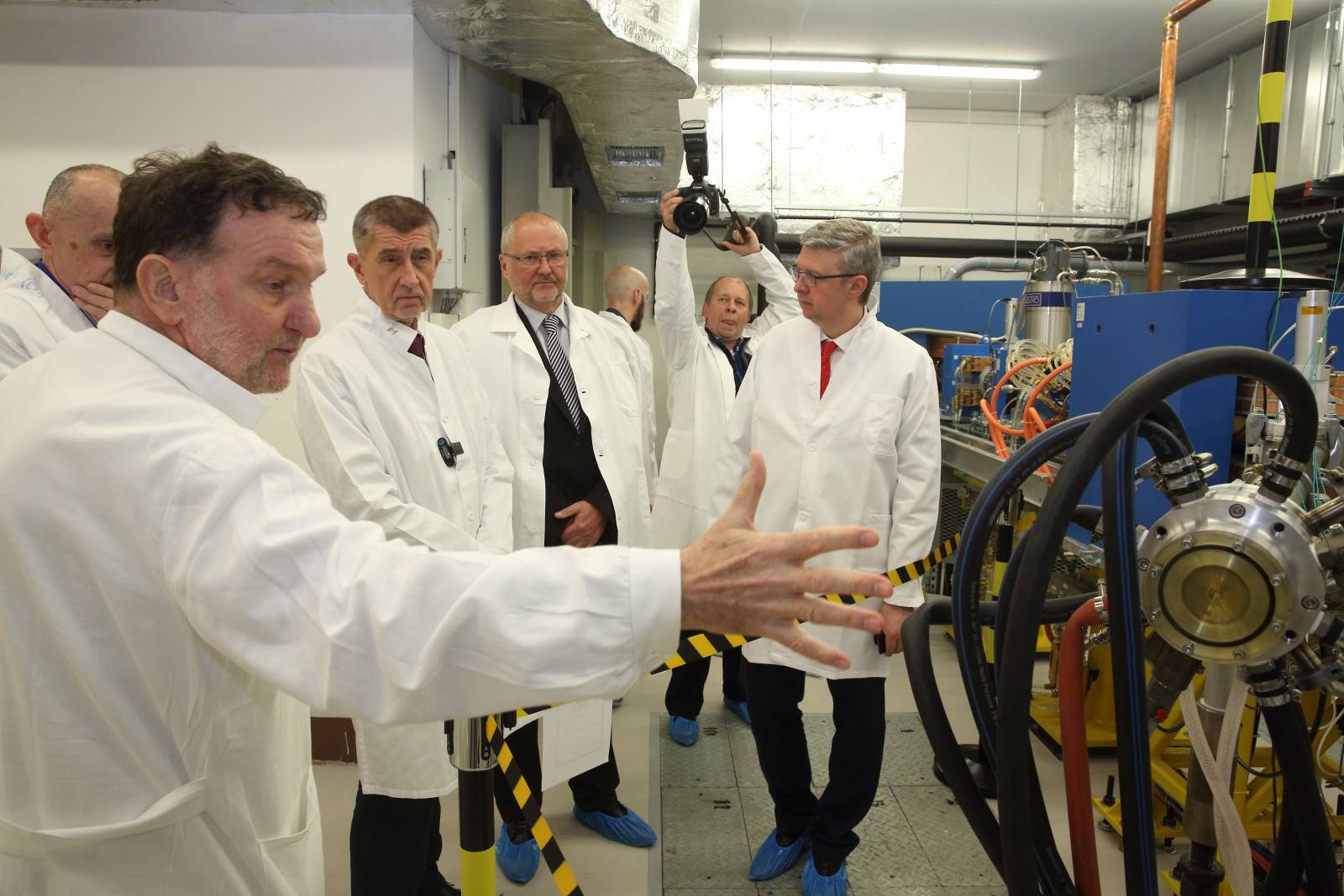 Prime Minister Andrej Babiš listens to the explanation of the head of the Department of Accelerators Jan Štursa