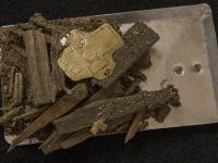 Parts of the wooden box relic with a golden plate